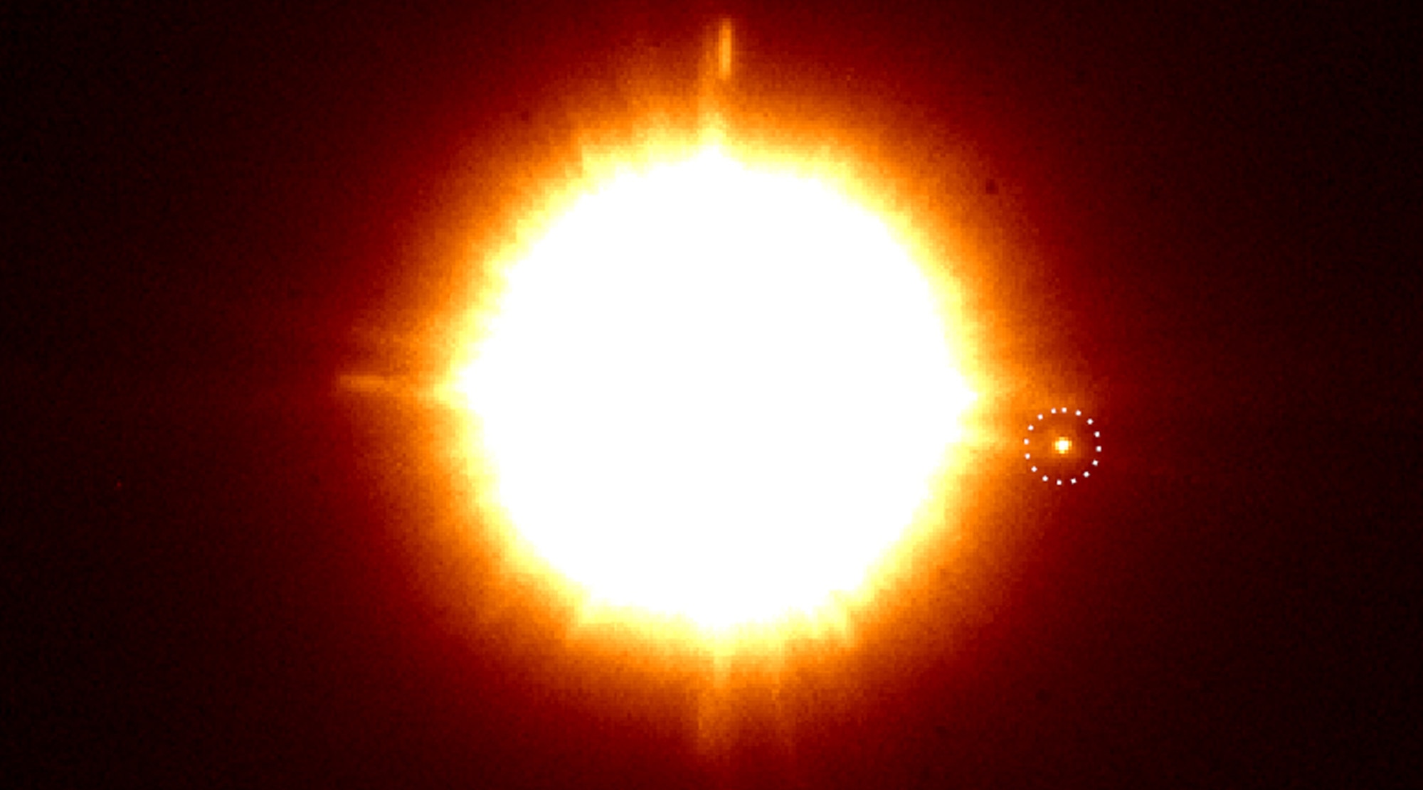 The binary star CS Cha (appearing as one star here due to their tight orbit) has a companion. But what is it? Credit: C. Ginski and SPHERE