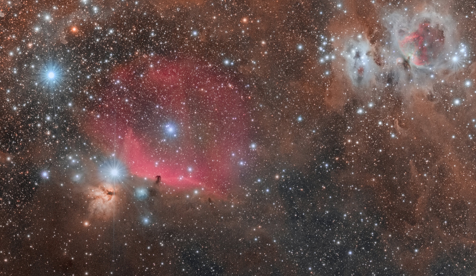 A spectacular wide-field shot of Orion's Belt, featuring the Horsehead, Flame, and Orion Nebula (and lots of other stuff too). Credit: Derek Demeter