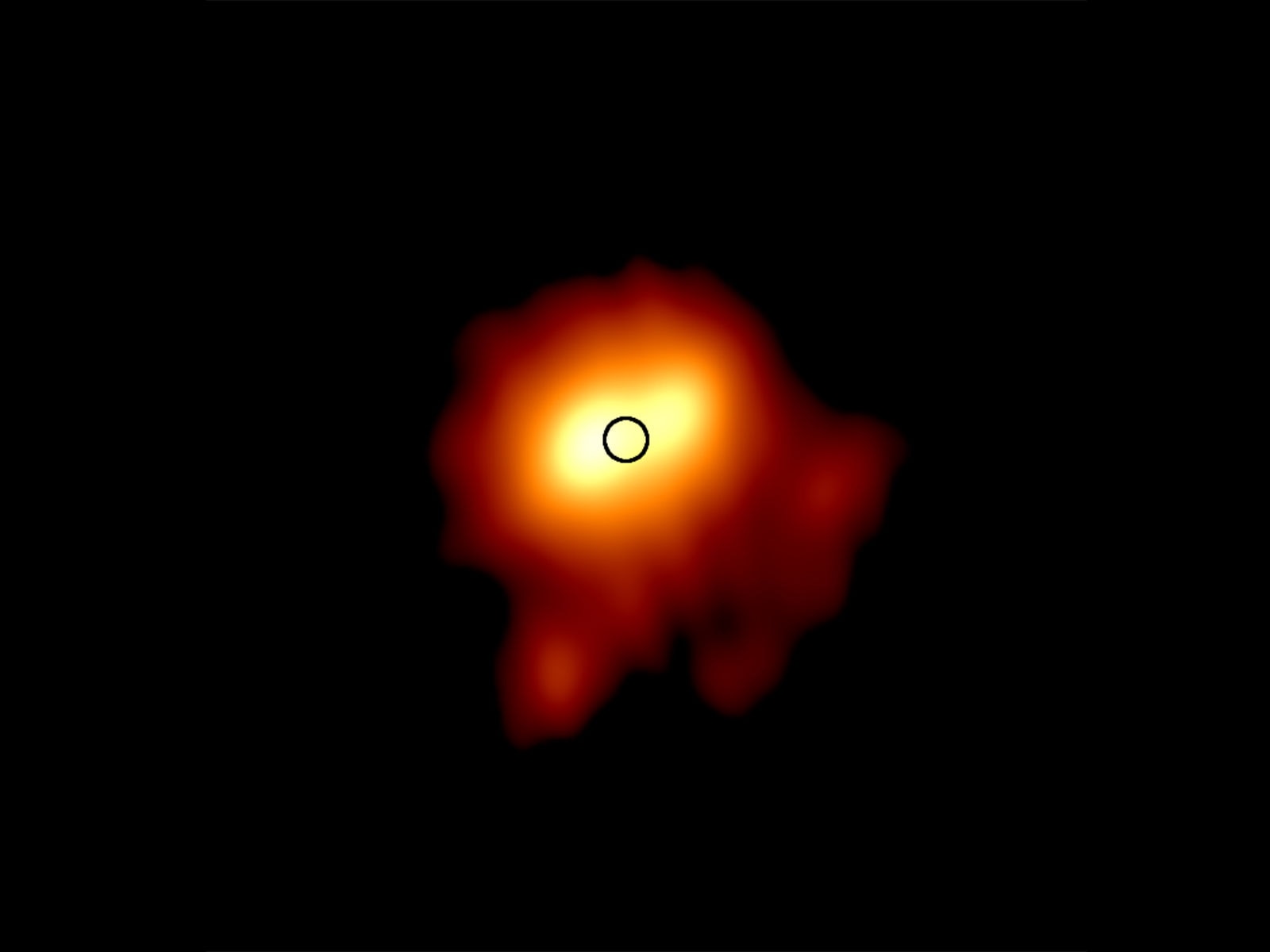 An image of the star Betelgeuse by the e-MERLIN radio telescope shows it has blown out a huge plume of gas, nearly as large as our entire solar system. The black circle denotes the size of the star. Credit: University of Manchester