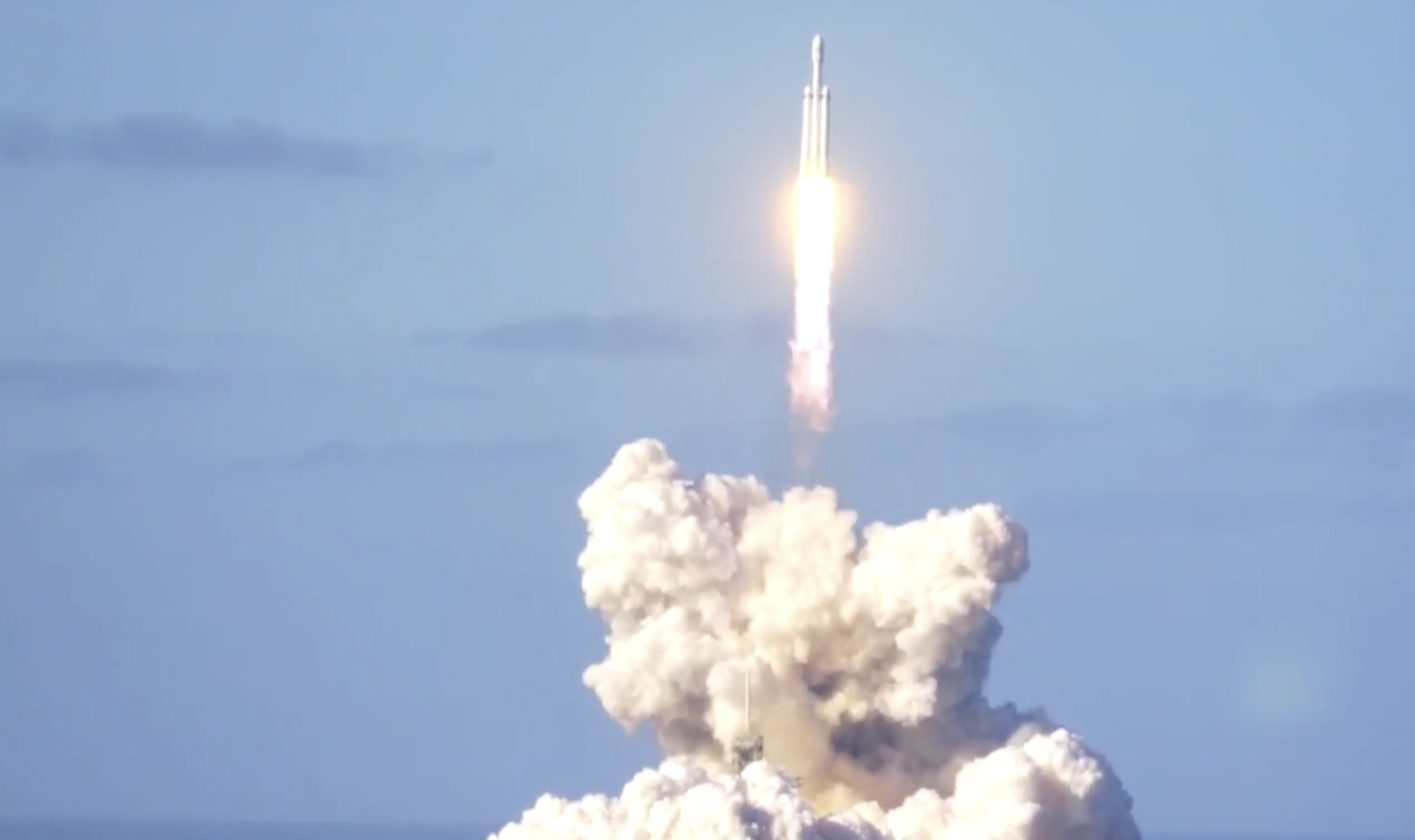The Falcon Heavy lifts off, on its way to orbit and then Mars. Credit: SpaceX
