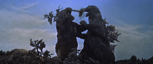 Kong_Shoves_Tree_In_Godzillas_Mouth