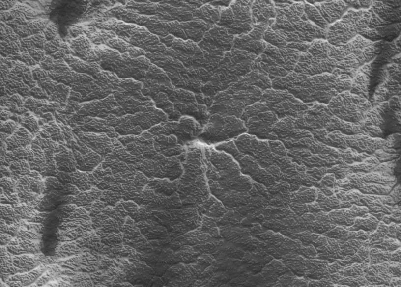 A system of radial channels carved in the Martian surface, called araneiforms, for “spider-like”. Credit: NASA/JPL/UArizona
