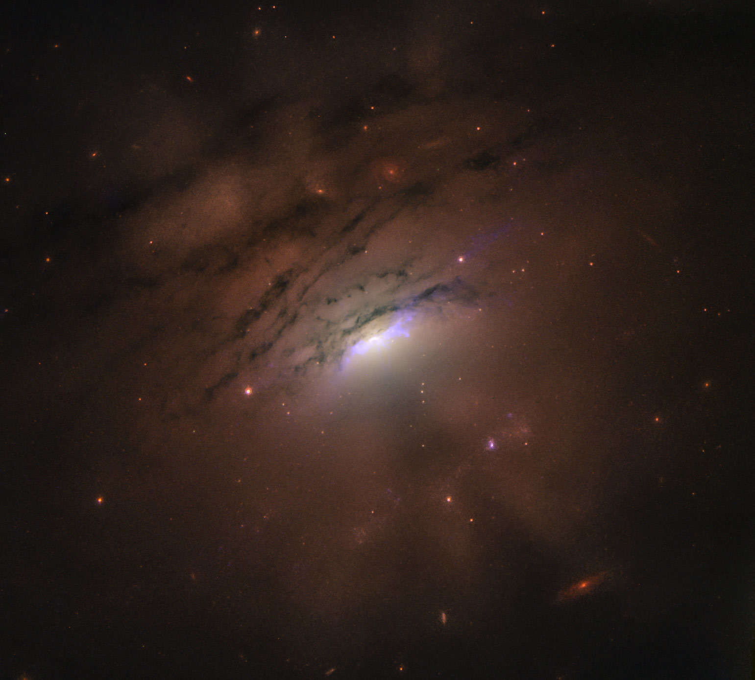 IC 5063 is an active galaxy where shadows tens of thousands of light years long are being cast from the center. Credit: NASA, ESA, STScI and W. P . Maksym (CfA)