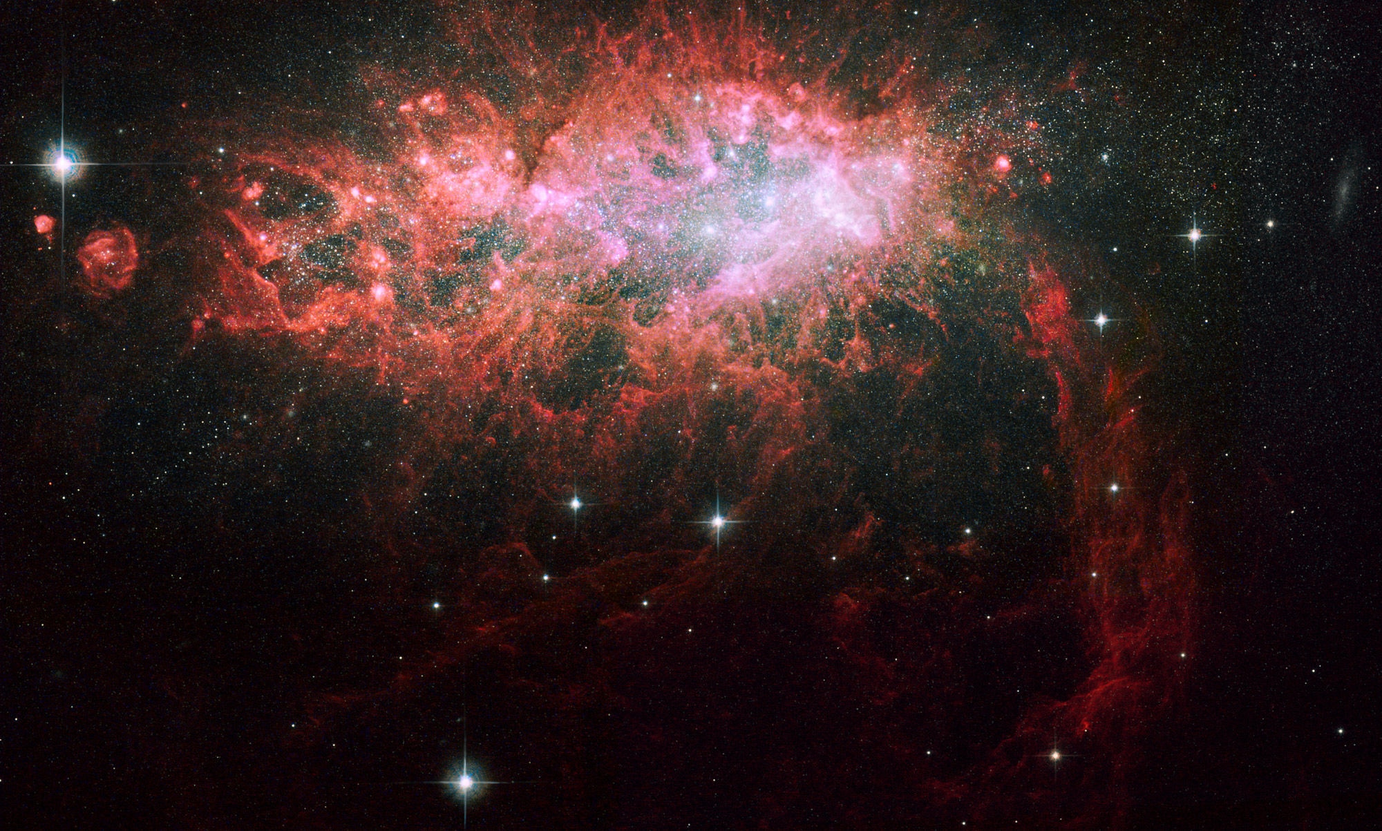 The nearby dwarf galaxy NGC 1569 is bursting with new stars. 