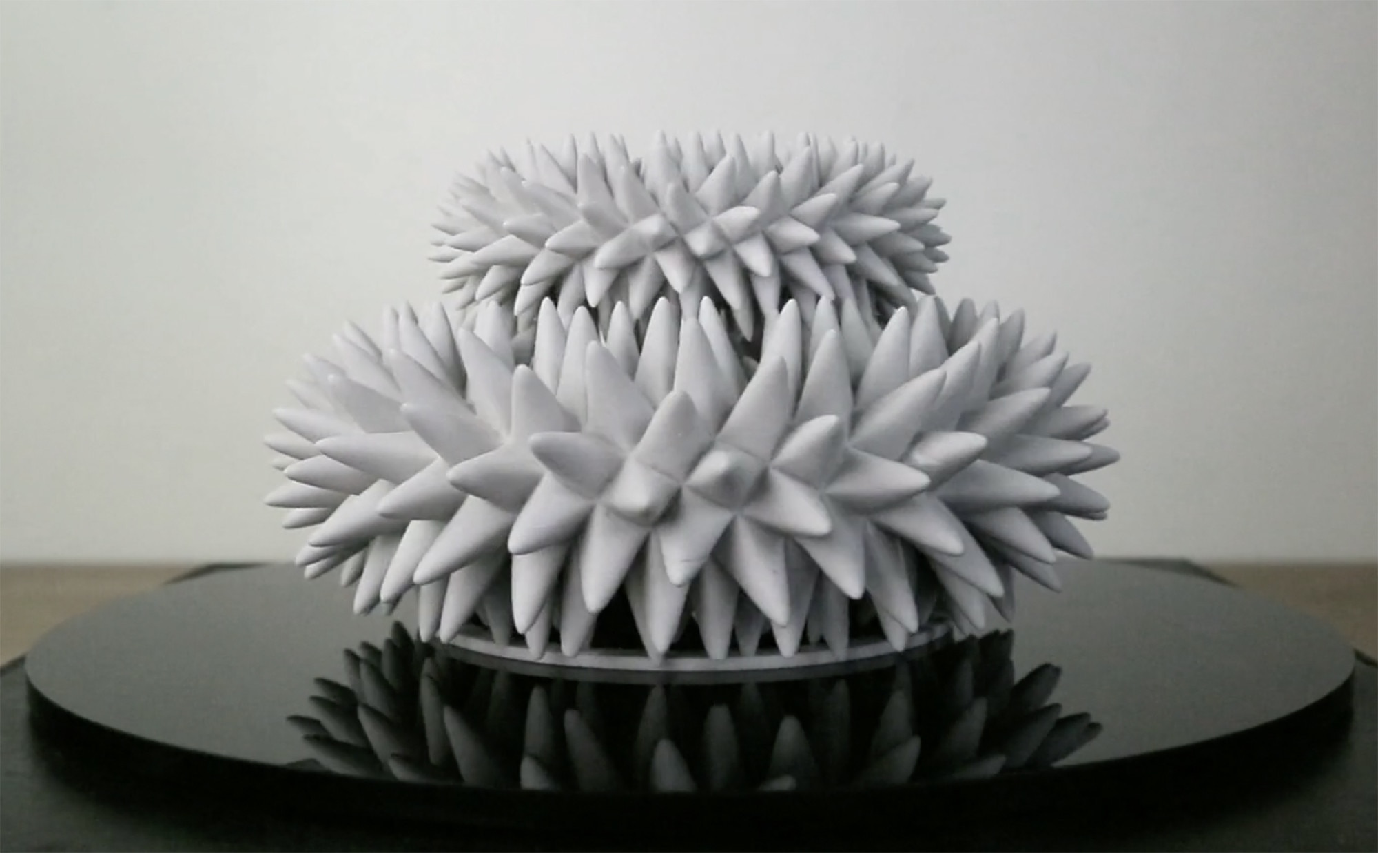 A 3D printed sculpture appears to wiggle and move when spun and lit by a strobe light on video. Credit: John Edmark, from the video