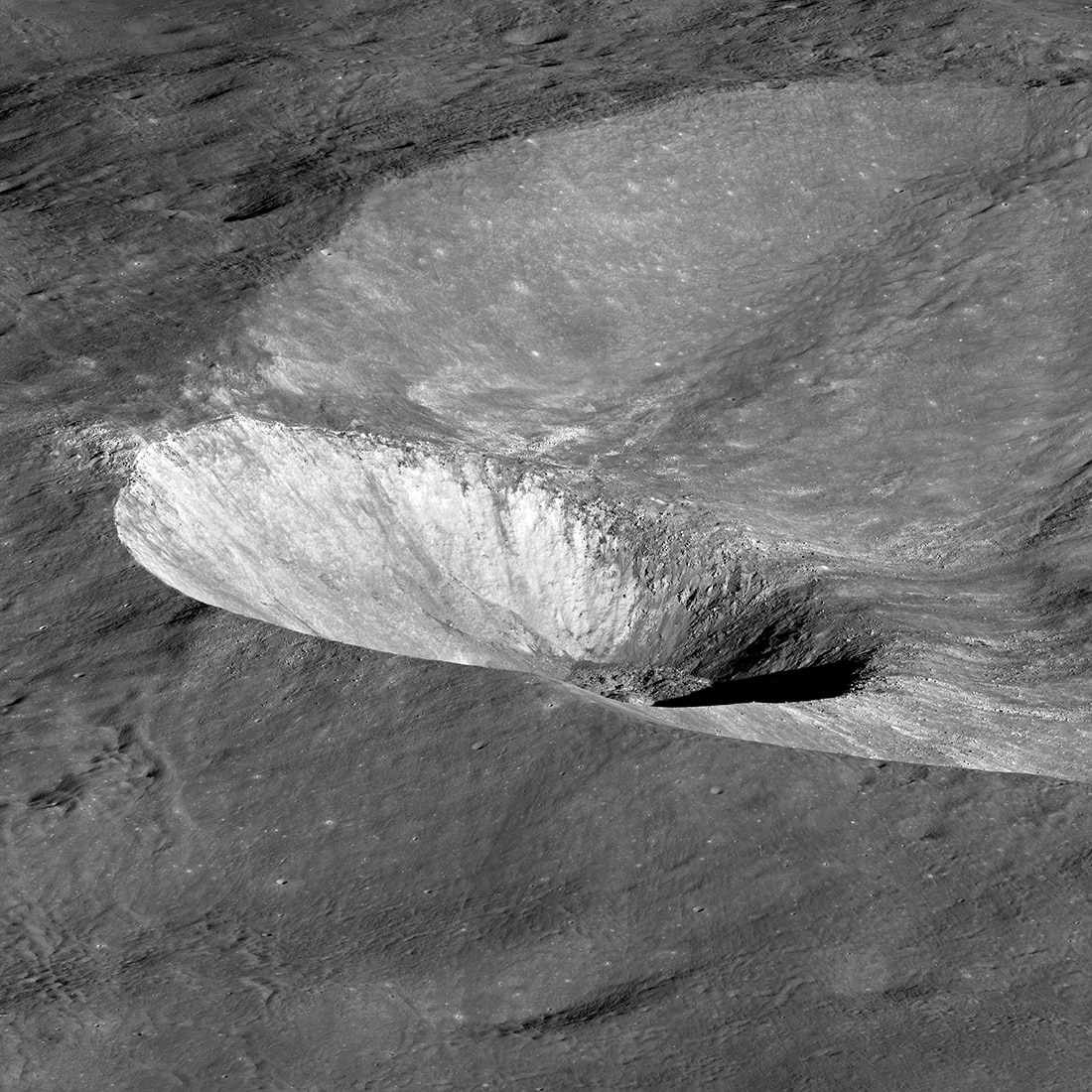 An oblique Lunar Reconnaissance Orbiter view of the lunar crater Hawke, which sits on the rim of the larger crater Grotrian. Credit: NASA/GSFC/Arizona State University