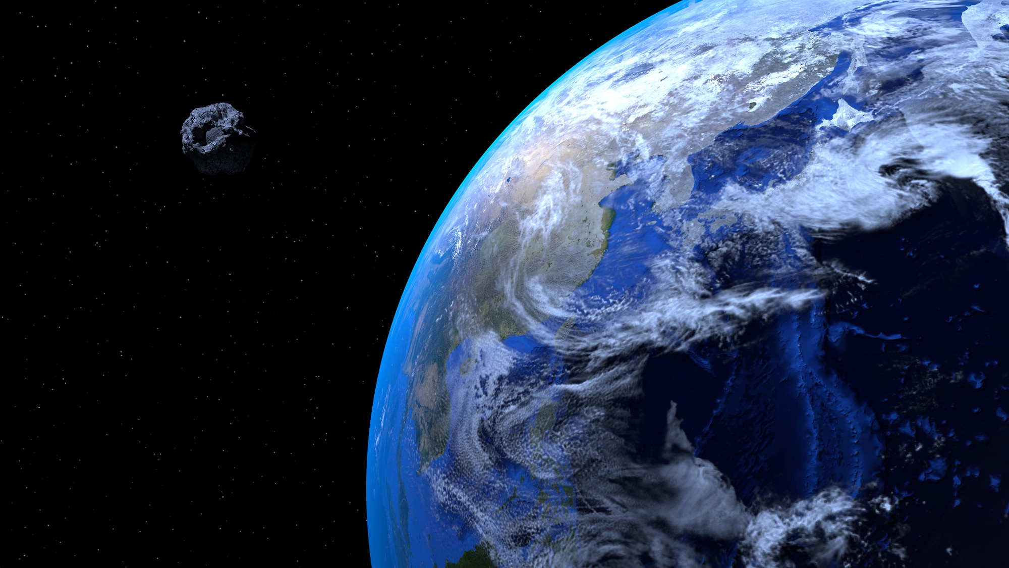 An artist’s concept of an asteroid passing quite close to Earth.