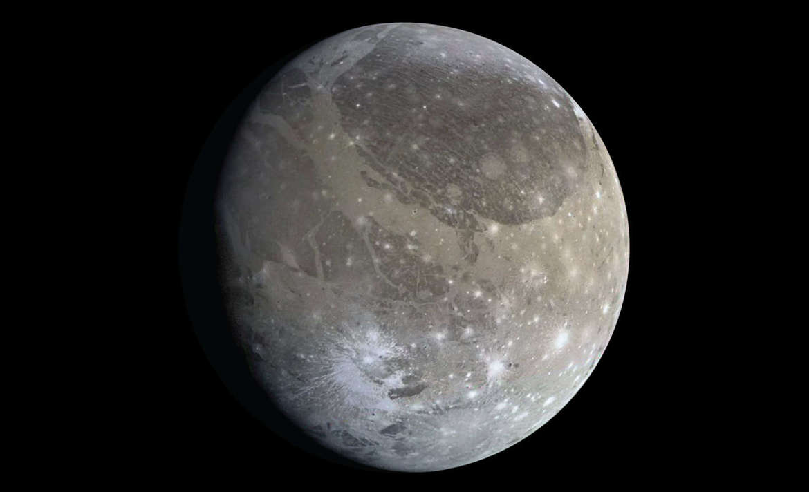 Jupiterâ€™s moon Ganymede, showing the dark and light terrains; the furrows can be seen to the upper right in the dark terrain. Credit: NASA / JPL-Caltech / Emily Lakdawalla