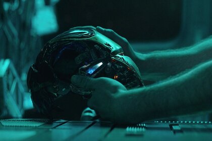 Tony Stark with Iron Man helmet in Avengers Endgame