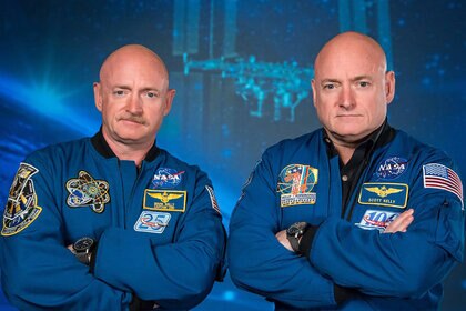 Austronauts Mark Kelly at Left with twin brother Scott Kelly