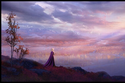 Elsa stands alone overlooking an enchanted forest