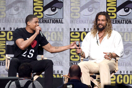 Ray Fisher and Jason Momoa at the Justice League Presentation at San Diego Comic Con in 2017
