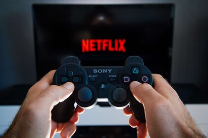 Netflix logo and PlayStation game controller