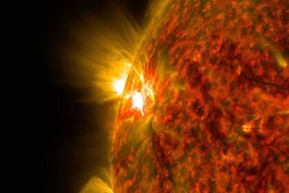 An M-class flare on the left side of the sun.