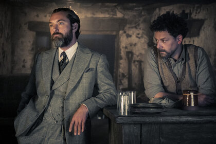 JUDE LAW as Albus Dumbledore and RICHARD COYLE as Aberforth