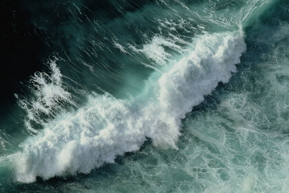 Ocean wave crashing, overhead view