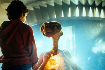 Henry Thomas talking with ET in a scene from the film 'E.T. The Extra-Terrestrial', 1982.
