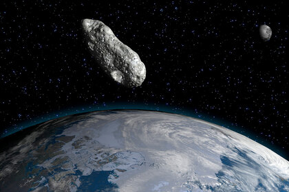 Artwork of an asteroid and planet earth.