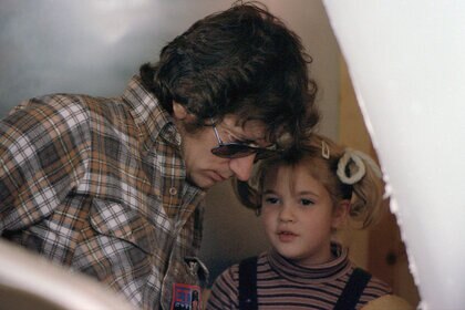 Steven Spielberg and Drew Barrymore on the set of E.T. (1982)