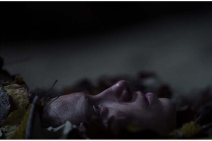 A woman in leaves in You Won't Be Alone (2021)