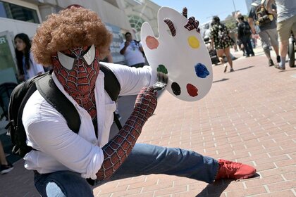 A cosplayer dressed as mash-up of Bob Ross and Spider-Man at San Diego Comic-Con 2023 Day 3