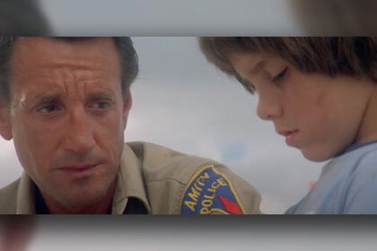 Marc Gilpin and a child in Jaws 2 (1978)
