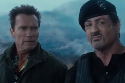 Arnold Schwarzenegger and Sylvester Stallone wearing military clothing speak in The Expendables 2 (2012)