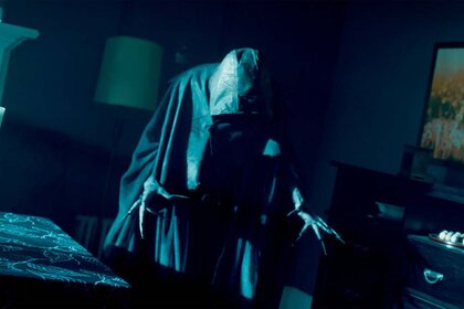 A hooded wraith creeps in the dark in SurrealEstate 201.