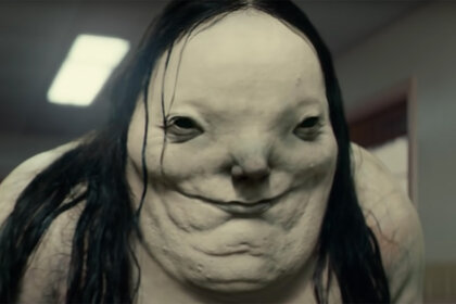 The pale lady smiles in Scary Stories to Tell in the Dark (2019).