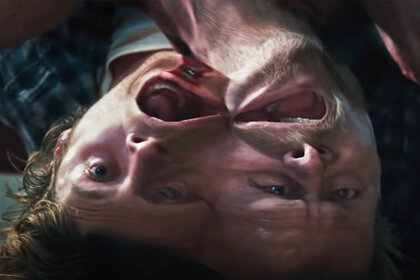 Two attached heads pull apart painfully in The Thing (2011).
