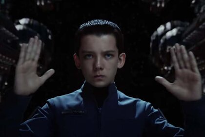 Ender Wiggin (Asa Butterfield) holds his hands up in concentration in Enders Game (2013).