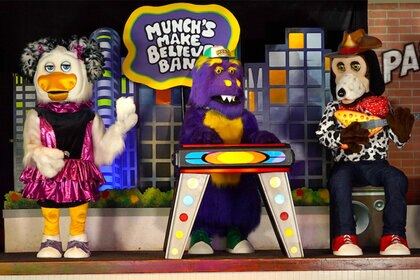 Chuck E. Cheese and Munch's Make Believe Band onstage at the Northridge, California location.