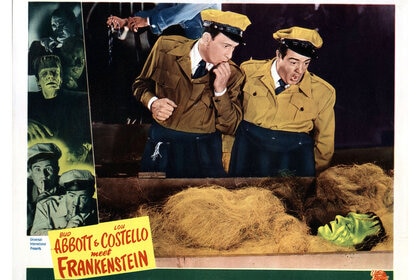 Bud Abbott and Lou Costello look upon Frankenstein (Glenn Strange) in Abbott And Costello Meet Frankenstein (1948).