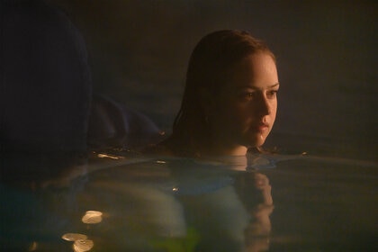 Izzy Waller swims in a pool in Night Swim