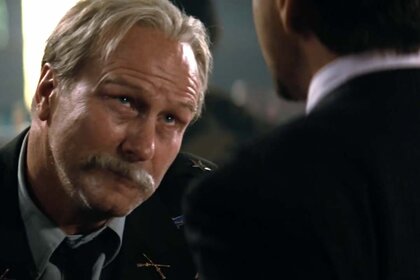 Thaddeus "Thunderbolt" Ross (William Hurt) looks up at a man in The Incredible Hulk (2008).