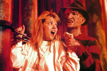 Kristen Parker (Tuesday Knight) screams from the grasp of Freddy Krueger (Robert Englund) for A Nightmare On Elm Street 4: The Dream Master (1988).