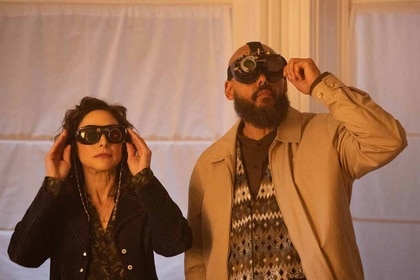 (l-r) Rochelle (Joy Tanner) and August Ripley (Maurice Dean Wint) peer up through special goggles in SurrealEstate 210