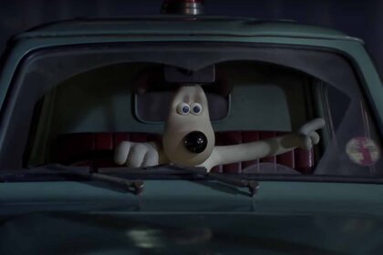 Gromit points frightened in a car in Wallace & Gromit: The Curse of the Were-Rabbit (2005).