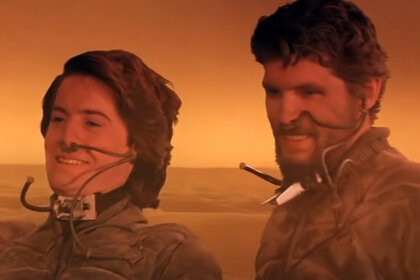 Kyle MacLachlan and Everett McGill are shrouded in orange sand in Dune (1984).