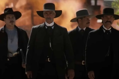 Doc Holliday and the Earp brothers walk together in Tombstone (1993).