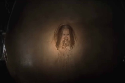 A completely swollen woman appears in Slither (2006).