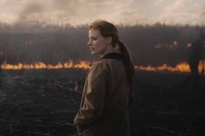 Murph (Jessica Chastain) stands in a scorching field in Interstellar (2014).