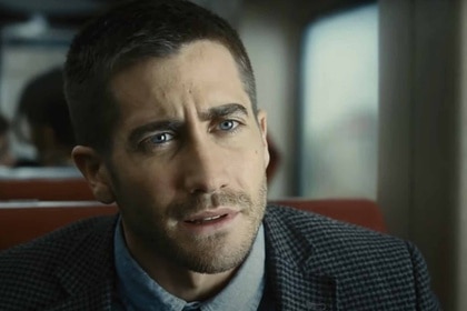 Colter Stevens (Jake Gyllenhaal) appears confused on a train in Source Code (2011).