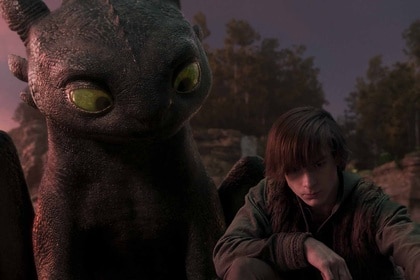 Toothless watches Hiccup (Mason Thames) in How to Train Your Dragon (2025).