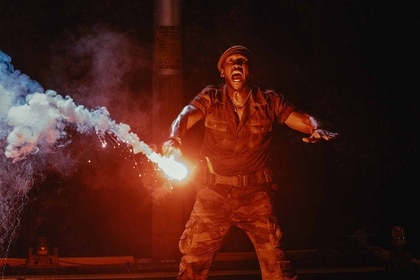Duncan Kincaid (Mahershala Ali) screams with a lit flare in his hand in Jurassic World Rebirth (2025).