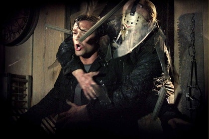 Jason Voorhees (Derek Mears) attacks and grabs Clay Miller (Jared Padalecki)in Friday the 13th (2009).