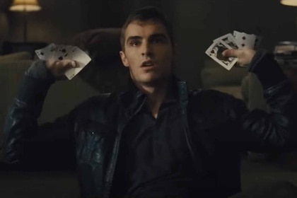 Jack Wilder (Dave Franco) holds a fan of playing cards in both hands in Now You See Me (2013).