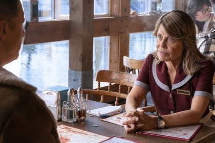 General Eleanor Wright (Linda Hamilton) sits at a diner table with Harry in Resident Alien Episode 403.
