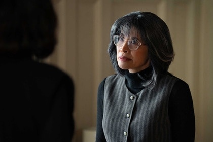 Anne standing in a room in Poker Face Season 2, Episode 9.