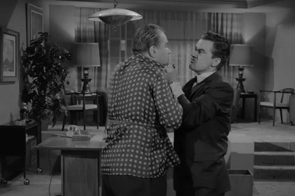 A man angrily grabs another man by the collar on The Twilight Zone Episode 113.